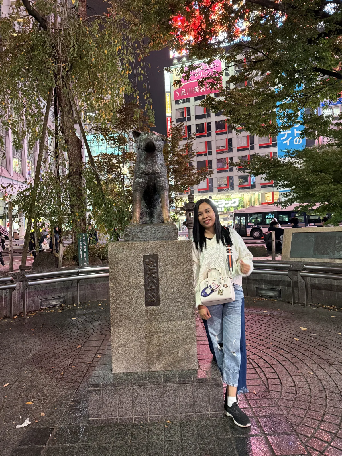 Mentari Rahman beside the Hachiko statue in Shibuya during a personal Japan trip